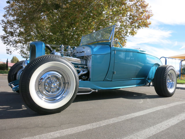 Turquoise 1929 Ford Model A Roadster with Turquoise and White interior