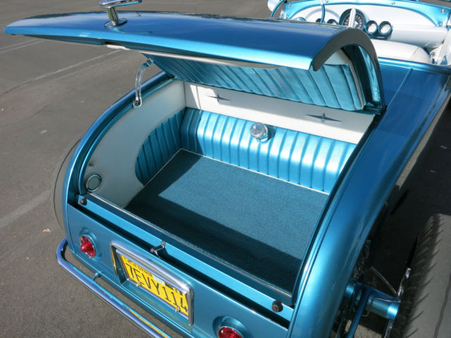 Turquoise 1929 Ford Model A Roadster with Turquoise and White interior