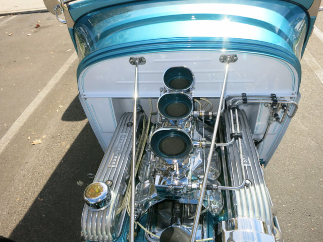 Turquoise 1929 Ford Model A Roadster with Turquoise and White interior