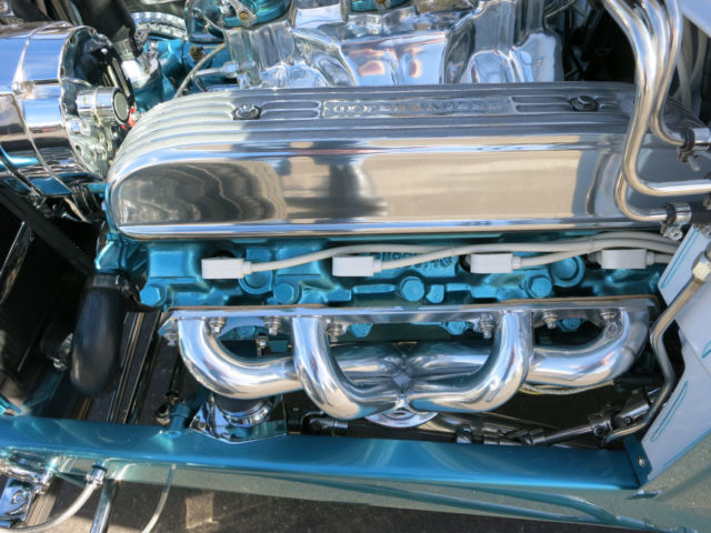 Turquoise 1929 Ford Model A Roadster with Turquoise and White interior