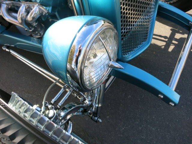 Turquoise 1929 Ford Model A Roadster with Turquoise and White interior