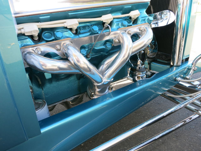 Turquoise 1929 Ford Model A Roadster with Turquoise and White interior
