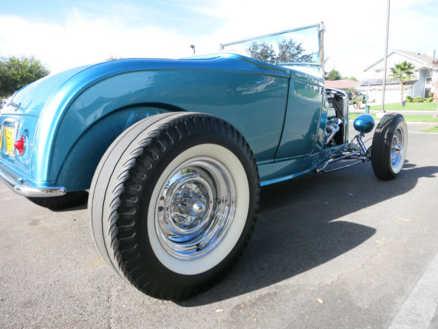 Turquoise 1929 Ford Model A Roadster with Turquoise and White interior