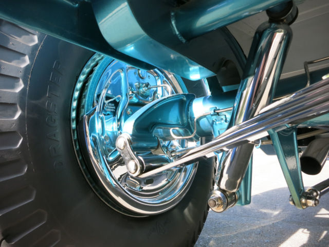 Turquoise 1929 Ford Model A Roadster with Turquoise and White interior