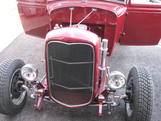 red 1930 Ford Model A Coupe with Tan interior