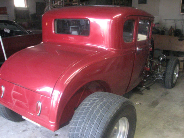 red 1930 Ford Model A Coupe with Tan interior