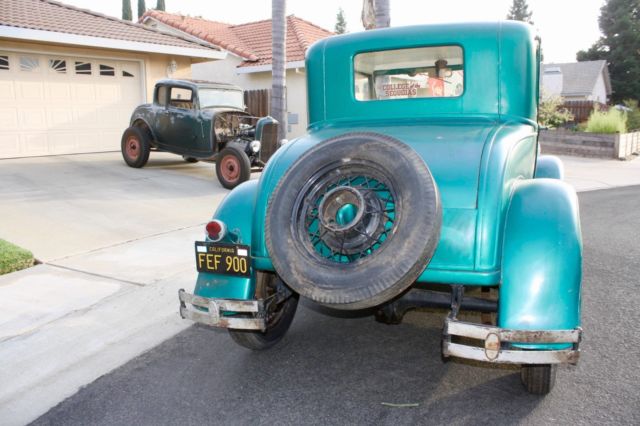 Green 1930 Ford Model A Coupe with White / Green interior