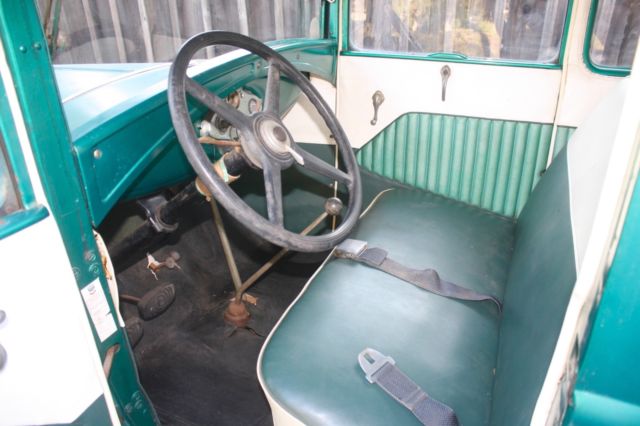 Green 1930 Ford Model A Coupe with White / Green interior