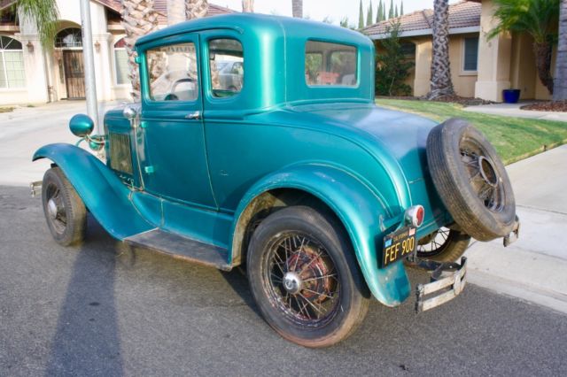 Green 1930 Ford Model A Coupe with White / Green interior