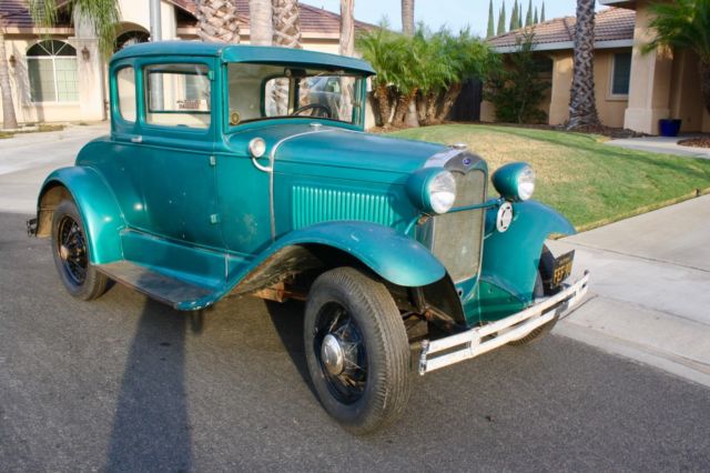 Green 1930 Ford Model A Coupe with White / Green interior