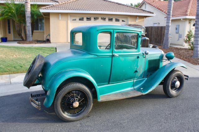 Green 1930 Ford Model A Coupe with White / Green interior