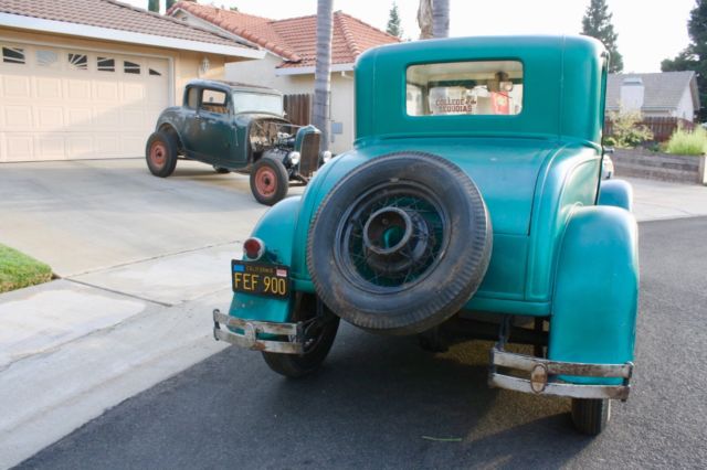 Green 1930 Ford Model A Coupe with White / Green interior