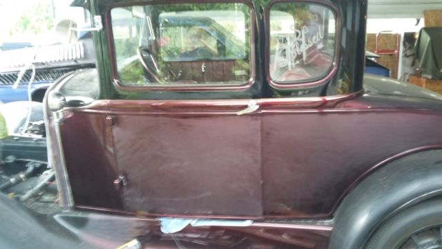 Red 1931 Ford Model A Coupe with Burgundy interior