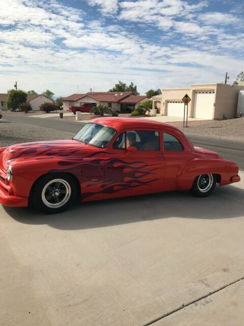 Orange 1954 Chevrolet 350ci with air Sedan