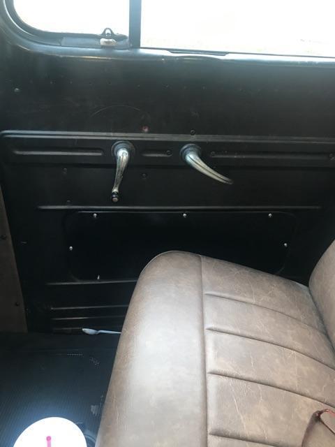 Black 1952 Ford F-100 Cab & Chassis with Brown interior