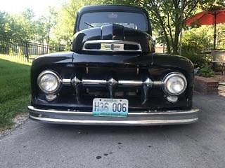 Black 1952 Ford F-100 Cab & Chassis with Brown interior
