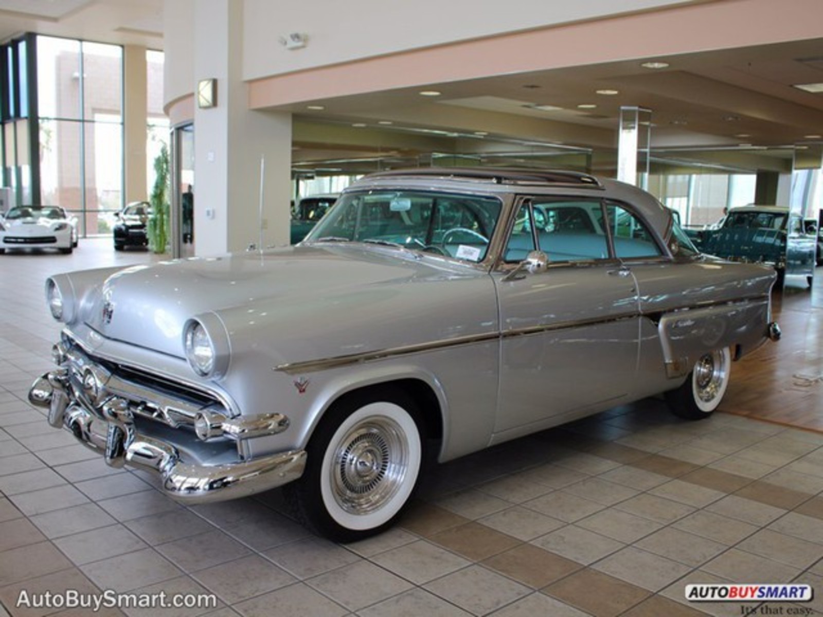 Silver 1954 Ford Crestline with Gray interior