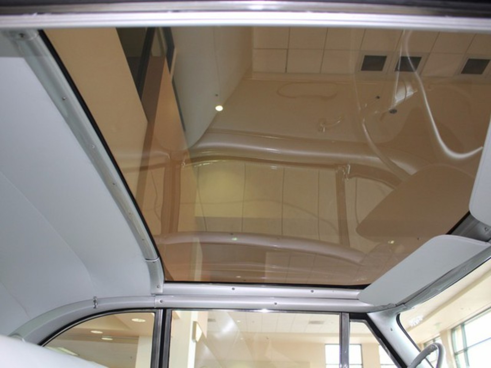 Silver 1954 Ford Crestline with Gray interior