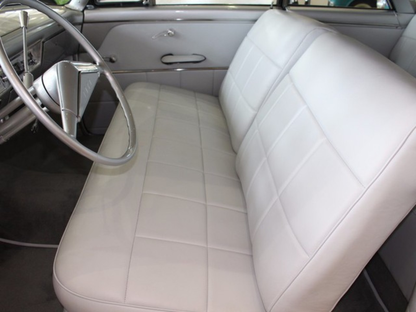 Silver 1954 Ford Crestline with Gray interior