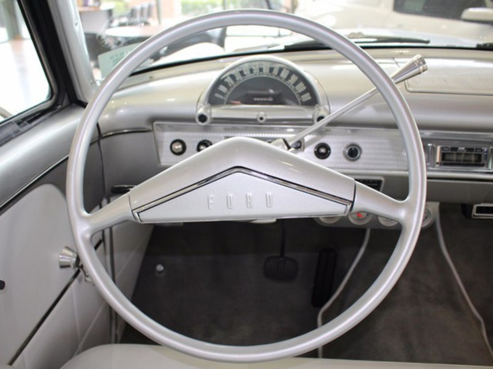Silver 1954 Ford Crestline with Gray interior