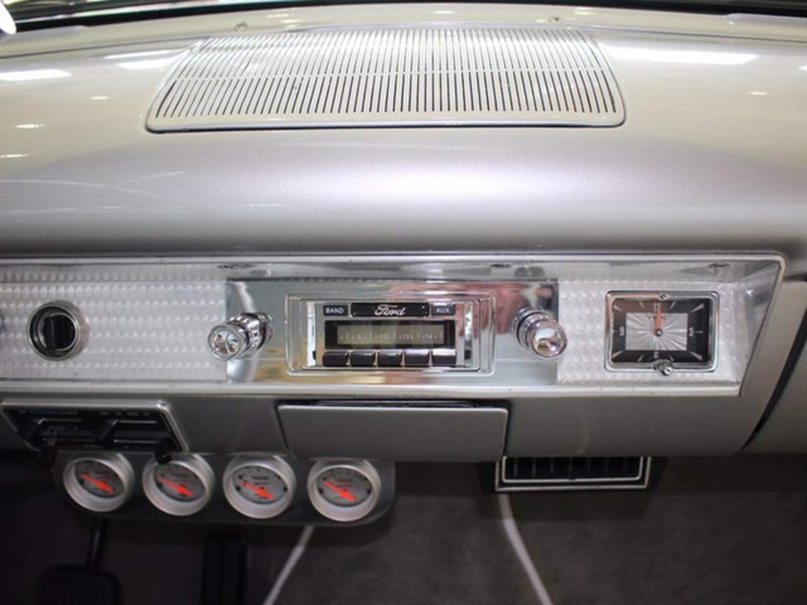 Silver 1954 Ford Crestline with Gray interior