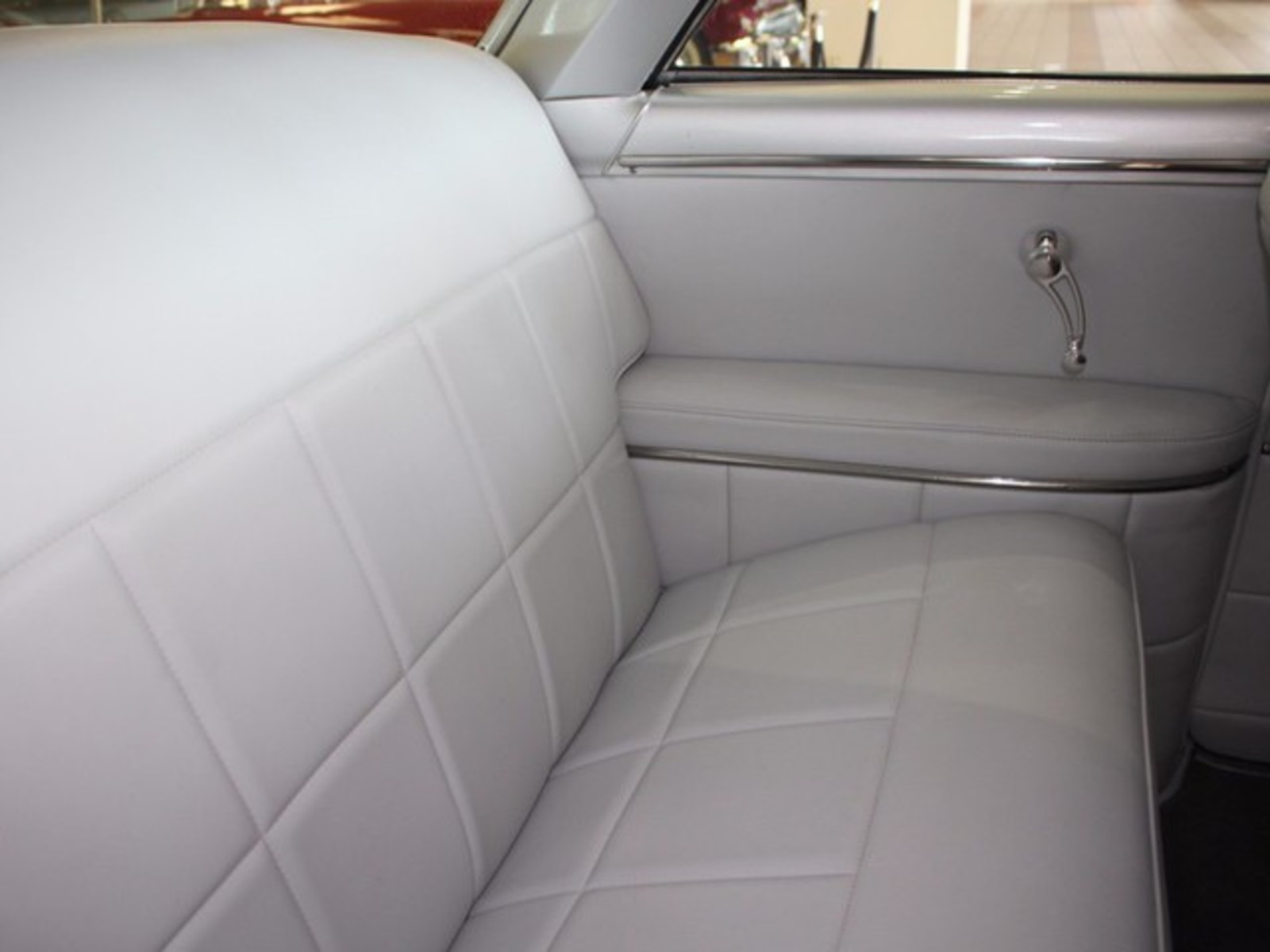Silver 1954 Ford Crestline with Gray interior