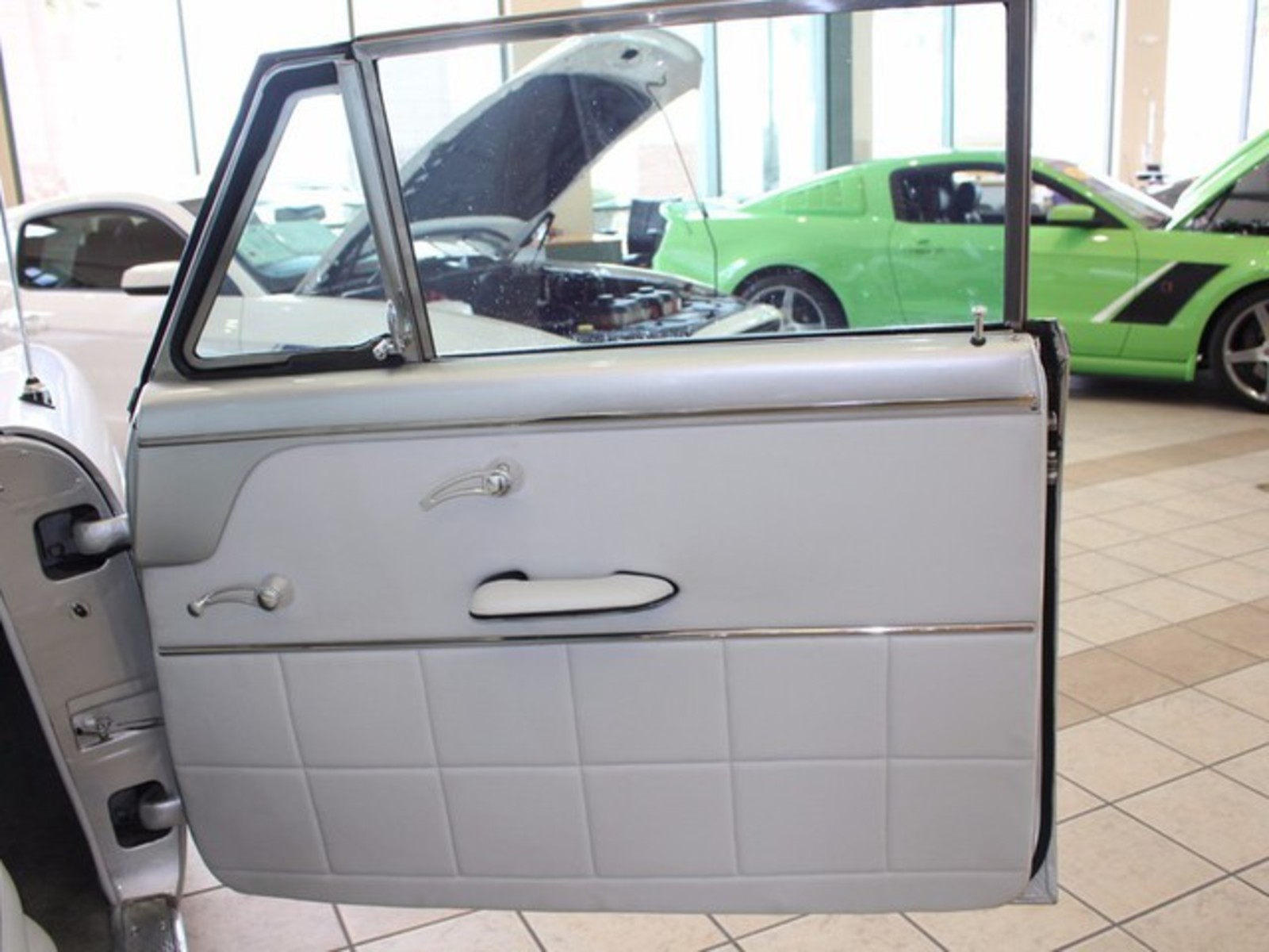 Silver 1954 Ford Crestline with Gray interior