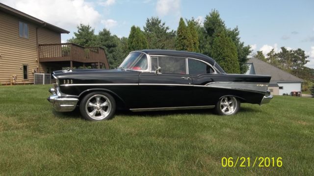 Black 1957 Chevrolet Bel Air/150/210 with Red interior