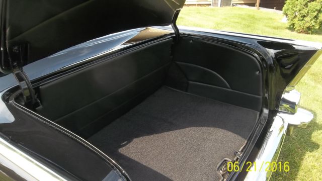 Black 1957 Chevrolet Bel Air/150/210 with Red interior