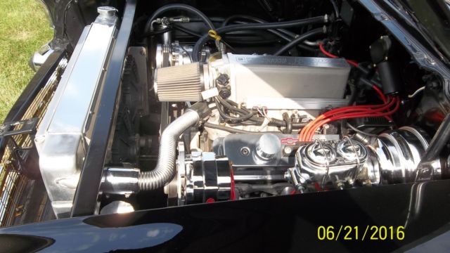 Black 1957 Chevrolet Bel Air/150/210 with Red interior