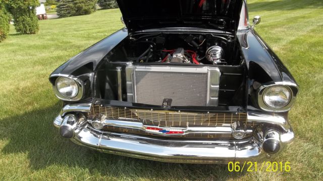 Black 1957 Chevrolet Bel Air/150/210 with Red interior