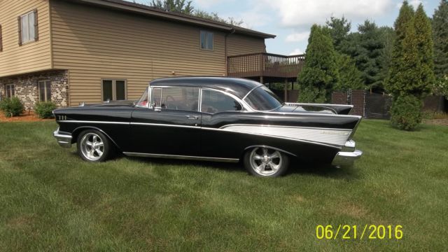Black 1957 Chevrolet Bel Air/150/210 with Red interior