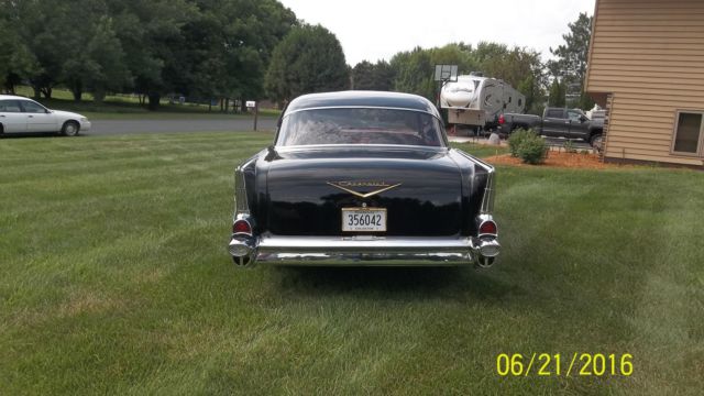 Black 1957 Chevrolet Bel Air/150/210 with Red interior