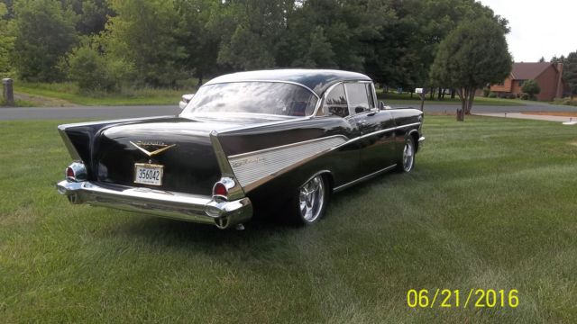 Black 1957 Chevrolet Bel Air/150/210 with Red interior