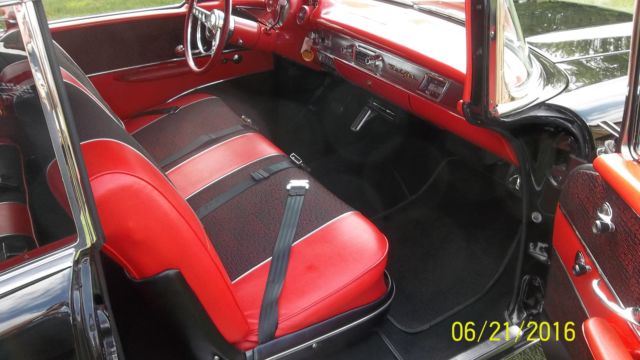 Black 1957 Chevrolet Bel Air/150/210 with Red interior
