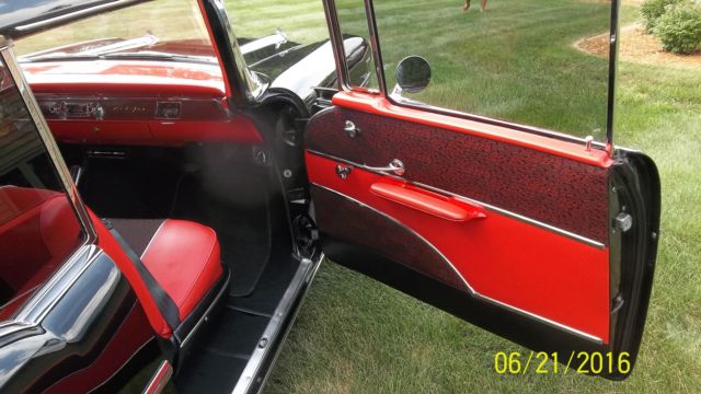 Black 1957 Chevrolet Bel Air/150/210 with Red interior