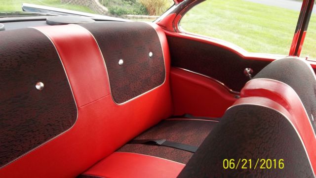 Black 1957 Chevrolet Bel Air/150/210 with Red interior