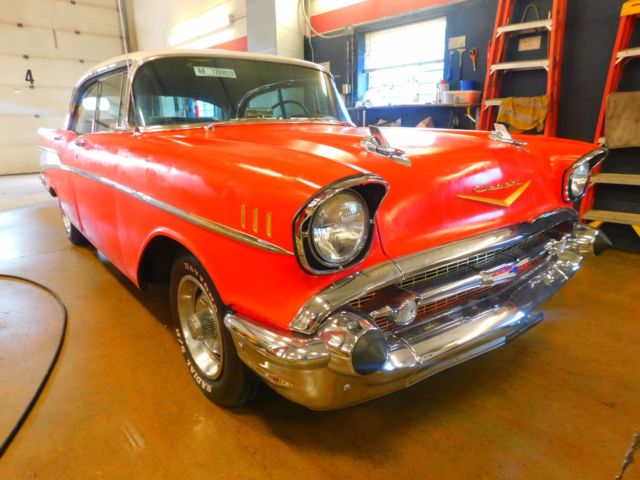 Red 1957 Chevrolet Bel Air/150/210 Sedan