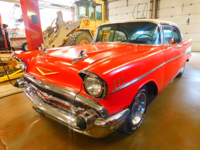 Red 1957 Chevrolet Bel Air/150/210 Sedan