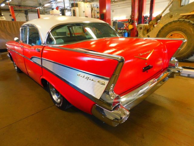Red 1957 Chevrolet Bel Air/150/210 Sedan