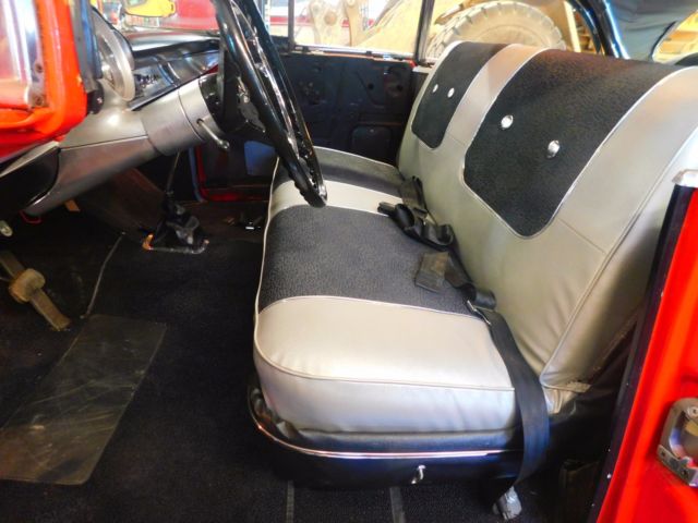 Red 1957 Chevrolet Bel Air/150/210 Sedan