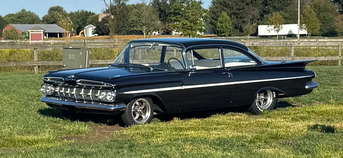 Black 1959 Chevrolet Bel Air/150/210 Coupe with White interior