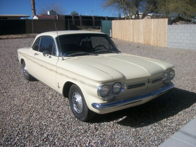 yellow 1962 Chevrolet Corvair coupe with Black interior