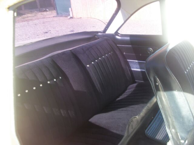 yellow 1962 Chevrolet Corvair coupe with Black interior