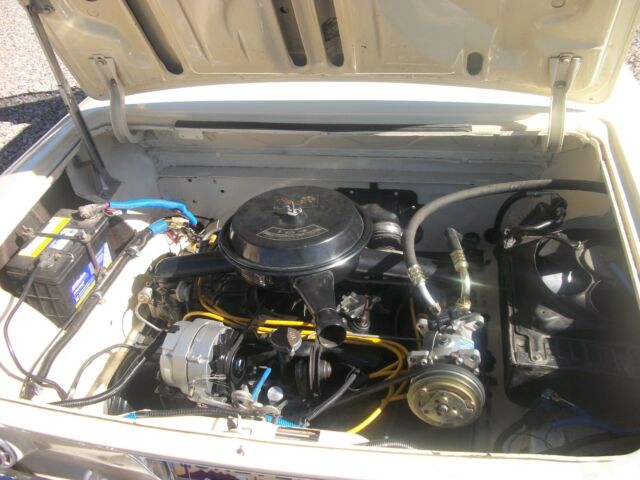 yellow 1962 Chevrolet Corvair coupe with Black interior