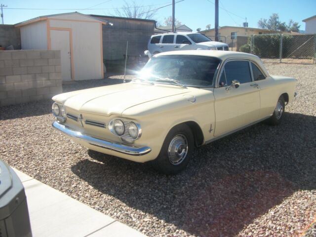 yellow 1962 Chevrolet Corvair coupe with Black interior