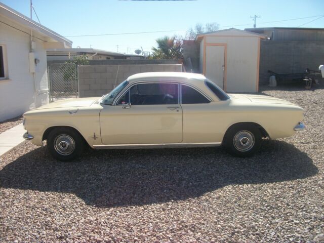 yellow 1962 Chevrolet Corvair coupe with Black interior