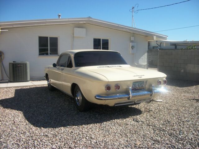yellow 1962 Chevrolet Corvair coupe with Black interior