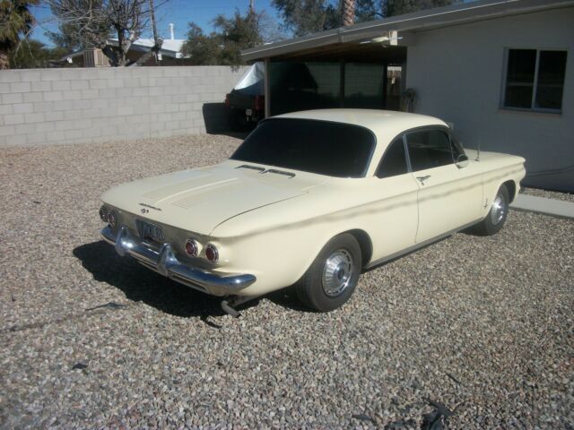yellow 1962 Chevrolet Corvair coupe with Black interior