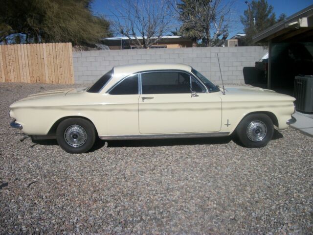 yellow 1962 Chevrolet Corvair coupe with Black interior